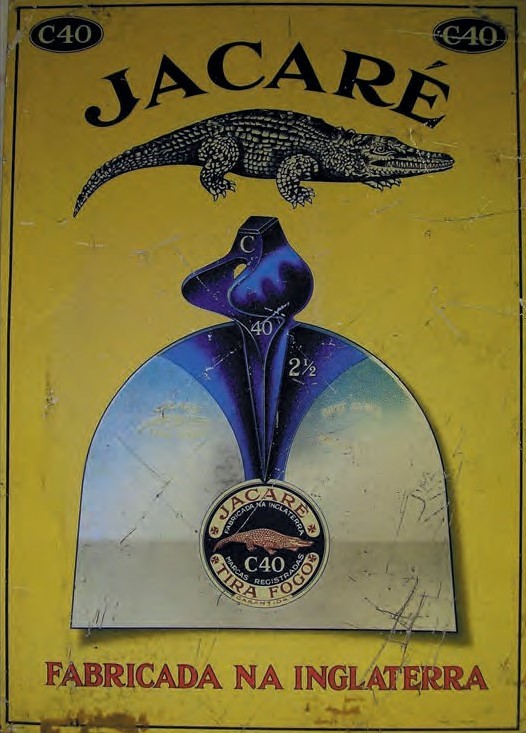 Enamel advertising sign showing an alligator.