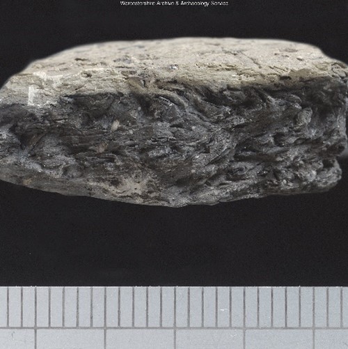 Photograph of sherd of Grass Tempered Ware pottery. Fabric 50 on the Worcestershire Ceramics Database.