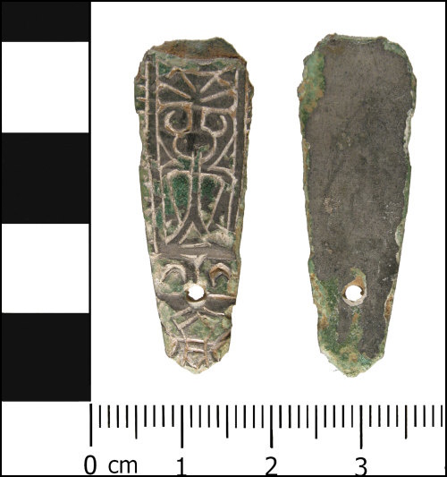 Photograph of Incomplete copper alloy strap end, with a silver or tin coating, dating from the Early Medieval period.